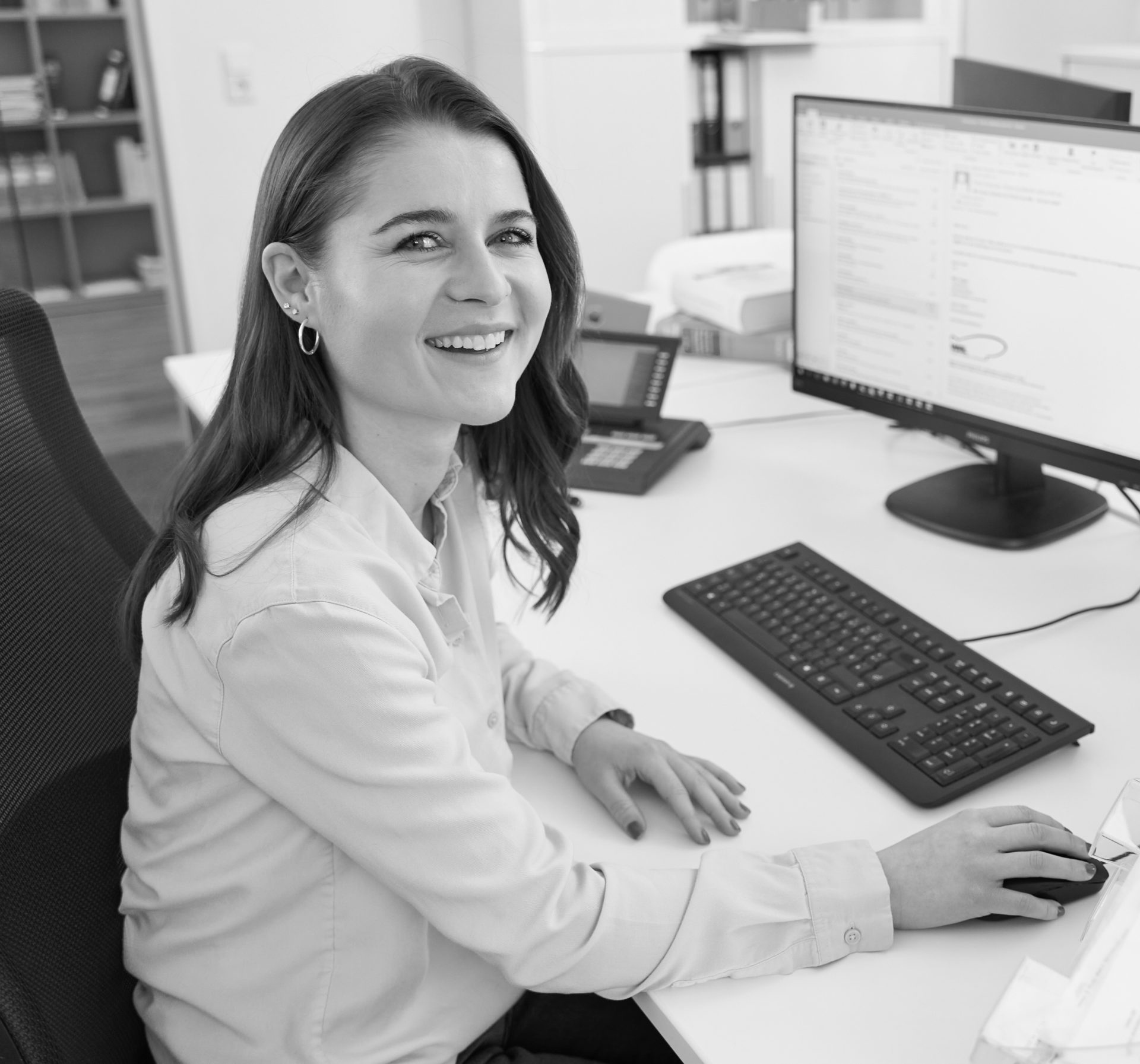 A professional financial advisor discusses options with a couple in a modern office setting.
